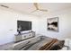 Relaxing bedroom featuring stylish furniture, a ceiling fan, and attractive wall art at 119 Cedar St, Henderson, NV 89015