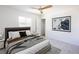 Inviting bedroom features neutral colors, a modern ceiling fan, and minimalist decor at 119 Cedar St, Henderson, NV 89015