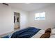 Inviting bedroom featuring a closet, a large window and modern decor at 119 Cedar St, Henderson, NV 89015