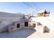 Outdoor brick fireplace and kitchen with counter space, surrounded by seating areas at 119 Cedar St, Henderson, NV 89015