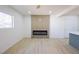 Bright, open living room featuring a fireplace and luxury vinyl plank flooring at 119 Cedar St, Henderson, NV 89015