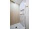 Chic shower showcasing neutral-toned tiles, a recessed shelf, and elegant gold fixtures at 119 Cedar St, Henderson, NV 89015