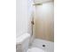 Modern shower with gold fixtures, tiled walls and floors, and a rainfall showerhead at 119 Cedar St, Henderson, NV 89015