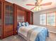 Bedroom with built-in storage, ceiling fan and window with shutters at 1276 Spanish Armada Rd, Las Vegas, NV 89123