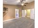Spacious carpeted bedroom with a ceiling fan and two large doorways at 1276 Spanish Armada Rd, Las Vegas, NV 89123