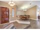 The entryway opens to the dining room and features wood-look tile and a beautiful wood door at 1276 Spanish Armada Rd, Las Vegas, NV 89123