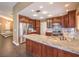 Beautiful kitchen with a spacious island, wood cabinets, stainless appliances, and granite counters at 1276 Spanish Armada Rd, Las Vegas, NV 89123