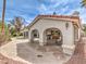 Outdoor kitchen and seating area with a built-in grill and bar under an open-air patio at 1276 Spanish Armada Rd, Las Vegas, NV 89123