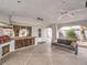 The covered outdoor living space features a grill, a seating area, and three ceiling fans at 1276 Spanish Armada Rd, Las Vegas, NV 89123