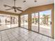 Bright sunroom with tile flooring and lots of windows overlooking the backyard at 1276 Spanish Armada Rd, Las Vegas, NV 89123