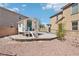 Backyard play area with sandbox, playhouse, and swing set at 145 Blue Trout Ave, Henderson, NV 89011