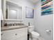 Bathroom featuring granite countertops, a white vanity, and neutral decor at 1550 Tiptop Trl, Pahrump, NV 89048