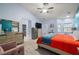 Cozy primary bedroom featuring vaulted ceilings, a ceiling fan, and ensuite bathroom access at 1550 Tiptop Trl, Pahrump, NV 89048