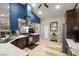 Open concept kitchen features dark cabinetry, stainless steel appliances, and overlooks living space at 1550 Tiptop Trl, Pahrump, NV 89048