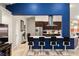 Kitchen featuring a breakfast bar with seating, stainless steel appliances, and dark cabinetry at 1550 Tiptop Trl, Pahrump, NV 89048