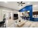 Bright living room features an open floor plan, stylish decor and leads into the kitchen at 1550 Tiptop Trl, Pahrump, NV 89048