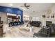 Open-concept living room with hardwood floors, fireplace and adjacent kitchen at 1550 Tiptop Trl, Pahrump, NV 89048