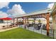 Outdoor dining area with a built-in grill, covered patio, and comfortable seating at 1550 Tiptop Trl, Pahrump, NV 89048