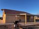 Home exterior showcases back patio and ample desert landscaping at 1900 E Highland Ave, Pahrump, NV 89048