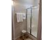 Standing shower with glass doors, and a stool next to a towel rack at 1900 E Highland Ave, Pahrump, NV 89048