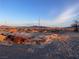Expansive desert landscape featuring native vegetation and clear blue skies during golden hour at 1900 E Highland Ave, Pahrump, NV 89048