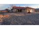 Inviting single-story home featuring desert landscaping and a covered front porch at 1900 E Highland Ave, Pahrump, NV 89048