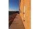 Side view of house with stucco wall and windows at 1900 E Highland Ave, Pahrump, NV 89048