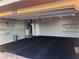 Large garage with shelving, water heater, and space for two cars or a workshop at 1900 E Highland Ave, Pahrump, NV 89048