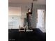Garage features water heater, water softener and door to outside at 1900 E Highland Ave, Pahrump, NV 89048