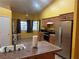 Bright kitchen featuring wooden cabinets, stainless steel appliances, and an eat-in area at 1900 E Highland Ave, Pahrump, NV 89048