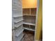 Well-organized pantry with shelving on the door and in the pantry for optimal storage solutions at 1900 E Highland Ave, Pahrump, NV 89048