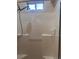 Standing shower with white tiles and clear glass doors at 1900 E Highland Ave, Pahrump, NV 89048