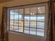 Close-up of a large window showcasing a view of the desert landscape and distant mountains at 1900 E Highland Ave, Pahrump, NV 89048