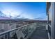 Balcony view showcases the cityscape and mountains at sunset, with glass railings at 2700 Las Vegas Blvd # 4306, Las Vegas, NV 89109