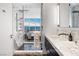 Modern bathroom featuring a glass-enclosed shower with marble accents and city views at 2700 Las Vegas Blvd # 4306, Las Vegas, NV 89109