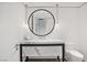 Elegant bathroom with marble vanity, round mirror, and modern fixtures at 2700 Las Vegas Blvd # 4306, Las Vegas, NV 89109