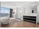 Luxurious bathroom with freestanding tub, marble shower, double vanity, and city views at 2700 Las Vegas Blvd # 4306, Las Vegas, NV 89109