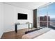 Bright bedroom features a desk, modern decor, and large windows with city views at 2700 Las Vegas Blvd # 4306, Las Vegas, NV 89109