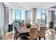 Elegant dining room features hardwood floors, floor-to-ceiling windows, and city views at 2700 Las Vegas Blvd # 4306, Las Vegas, NV 89109