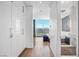 Modern hallway features lots of storage with a view into a bright bedroom with city views at 2700 Las Vegas Blvd # 4306, Las Vegas, NV 89109