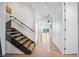 Bright hallway with hardwood floors, modern staircase, and floor-to-ceiling windows with city views at 2700 Las Vegas Blvd # 4306, Las Vegas, NV 89109