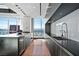 Modern kitchen with island, black cabinets, stainless steel appliances, and skyline views at 2700 Las Vegas Blvd # 4306, Las Vegas, NV 89109