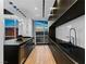 Gourmet kitchen with black cabinetry, wine fridge, city views, and stainless steel appliances at 2700 Las Vegas Blvd # 4306, Las Vegas, NV 89109