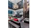 Spacious living room boasts a modern chandelier, large windows showcasing city views, and sleek, minimalist decor at 2700 Las Vegas Blvd # 4306, Las Vegas, NV 89109
