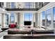 Modern living room with floor-to-ceiling windows, offering city views, sleek furniture, and plenty of natural light at 2700 Las Vegas Blvd # 4306, Las Vegas, NV 89109