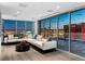 Modern living area with large windows showcasing city views, complemented by sleek furniture and minimalist design at 2700 Las Vegas Blvd # 4306, Las Vegas, NV 89109