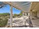 Beautiful covered patio with a pergola and stone-laid accents, perfect for relaxing at 2715 Riceville Dr, Henderson, NV 89052