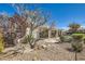 Low-maintenance backyard featuring desert landscaping, patio, and a covered pergola at 2715 Riceville Dr, Henderson, NV 89052