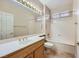 Bathroom featuring a vanity, large mirror, and shower-tub combination at 2715 Riceville Dr, Henderson, NV 89052