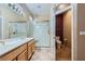 Well-lit bathroom boasting double sinks, a glass shower enclosure, and a separate toilet area at 2715 Riceville Dr, Henderson, NV 89052